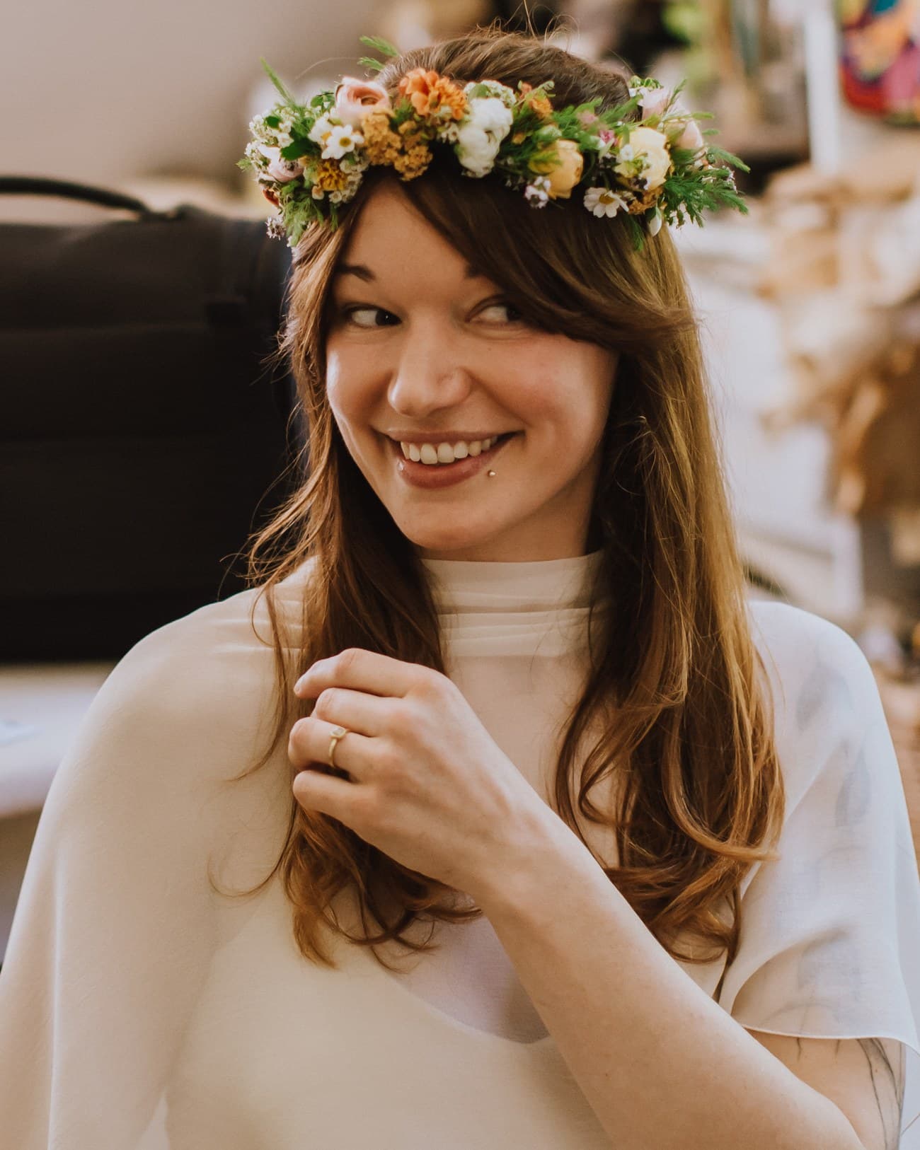 A bride in a flower crown, makeup by Lisa